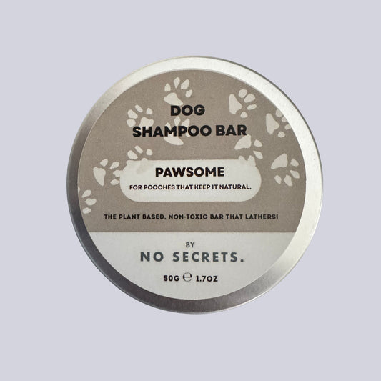 Dog shampoo bar packaging with 'Pawsome' and 'No Secrets' branding on a light gray background