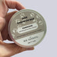 Hand holding a dog shampoo bar container labeled 'Pawsome' by 'No Secrets'.